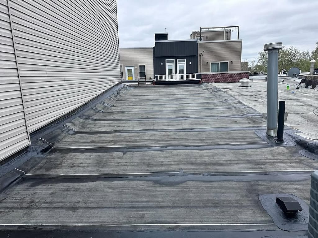 Seamless fiberglass membrane on a low-slope roof